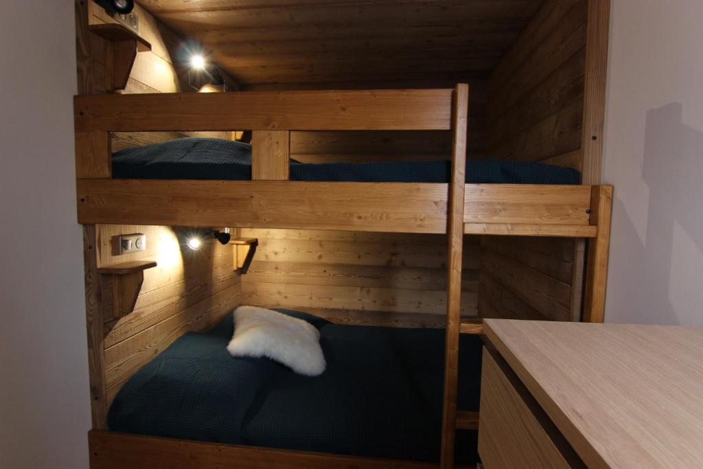 Postel nebo postele na pokoji v ubytování Trois Vallées Appartements VTI