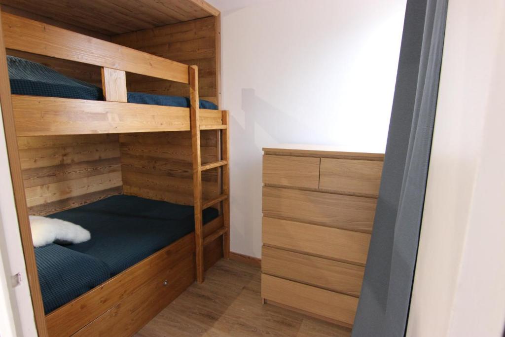 Postel nebo postele na pokoji v ubytování Trois Vallées Appartements VTI