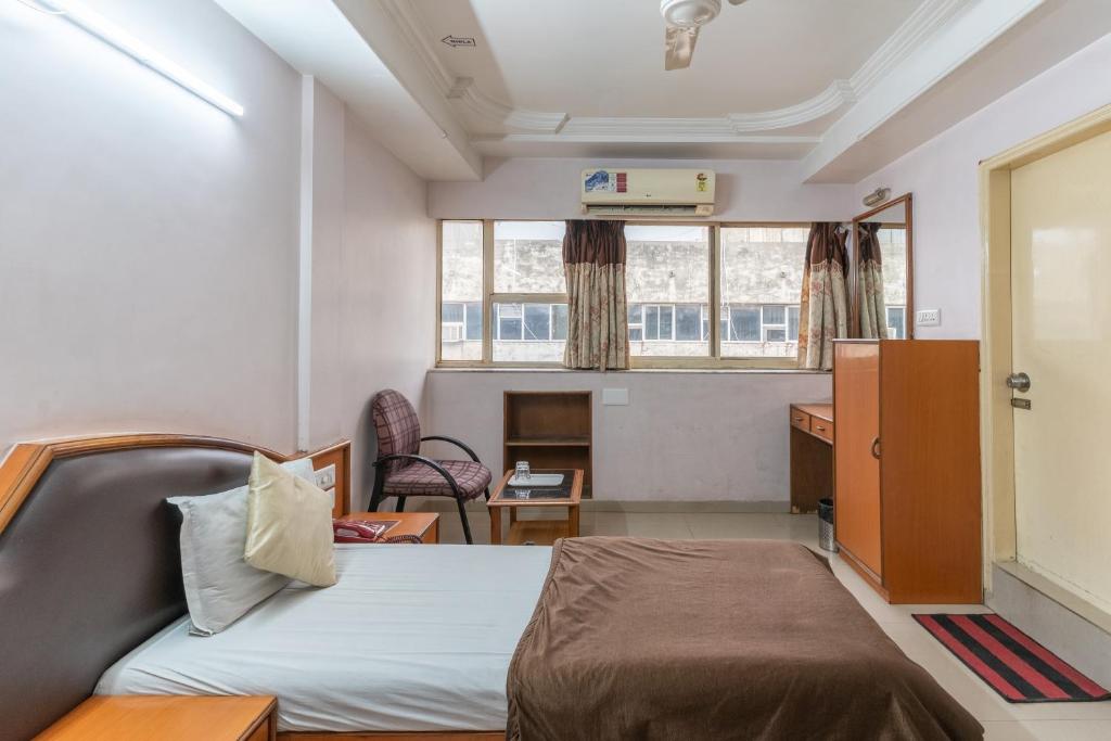 Postel nebo postele na pokoji v ubytování Hotel Sanmati
