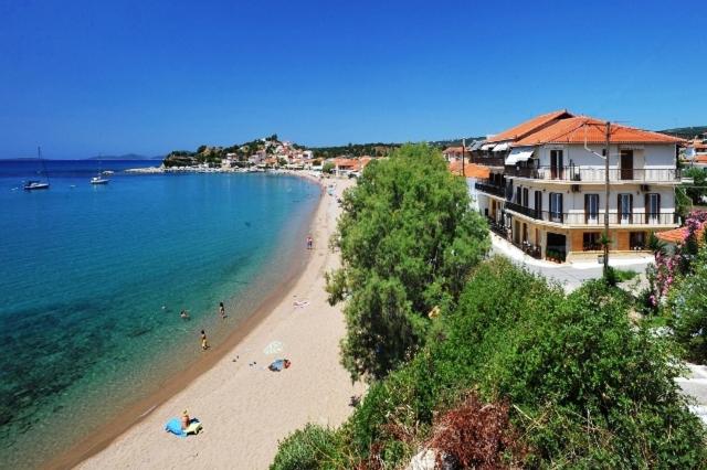 a view of a beach with people in the water at Hotel Korakakis Beach in Finikounta