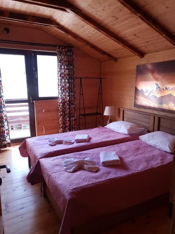 Postel nebo postele na pokoji v ubytování Villa Dabderr Mestia