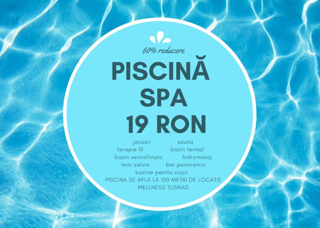 a swimming pool with a sign for a spa top room at Pensiunea Viktoria in Băile Tuşnad