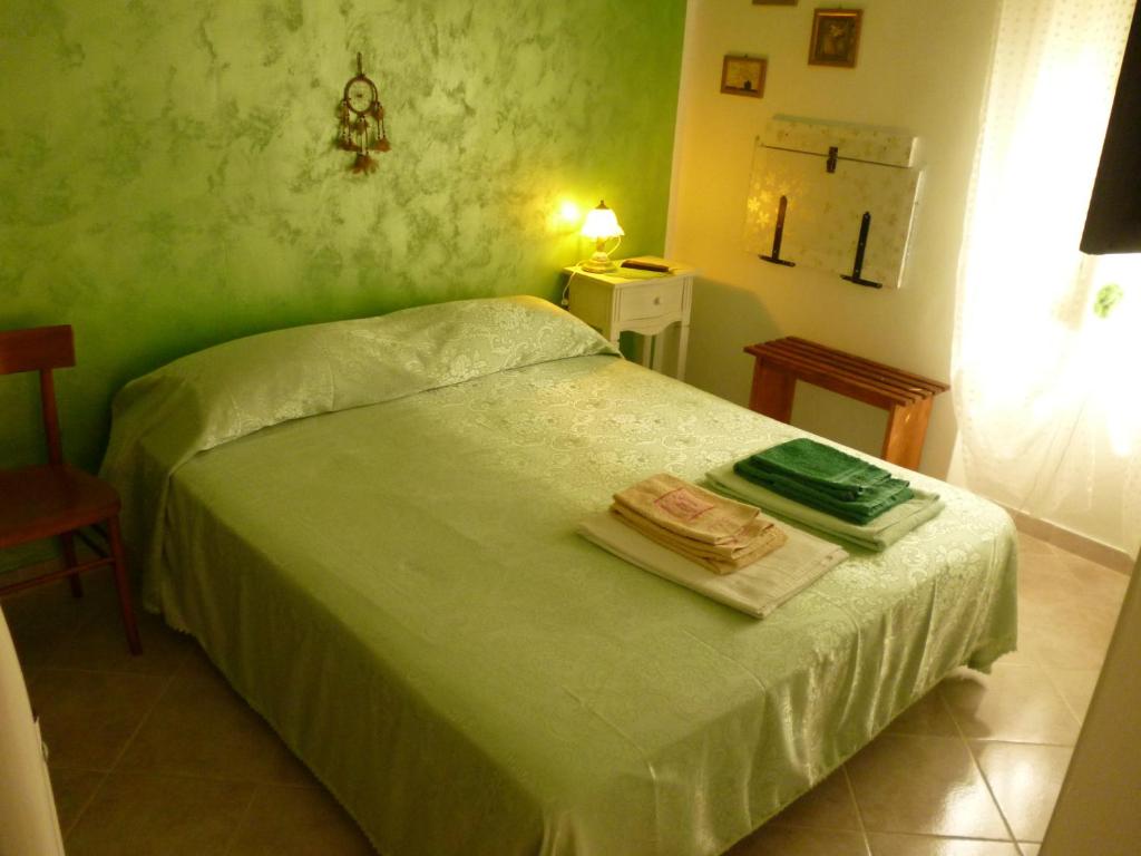 Postel nebo postele na pokoji v ubytování B&B Sunrise