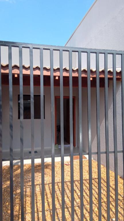 a white fence in front of a building at Flat mobiliada in Sinop