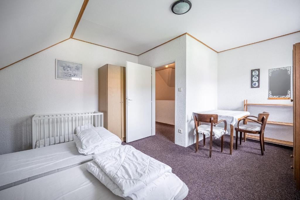 Łóżko lub łóżka w pokoju w obiekcie Vakantiehuis Cerny Dul 259
