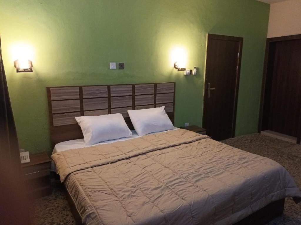 Ένα ή περισσότερα κρεβάτια σε δωμάτιο στο Border View ApartHotel and Events