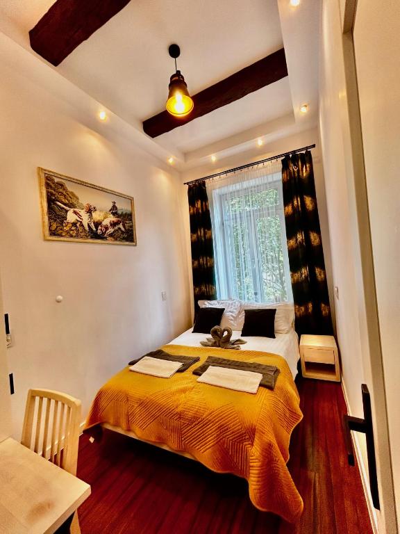 Posteľ alebo postele v izbe v ubytovaní Old Cracow Apartment