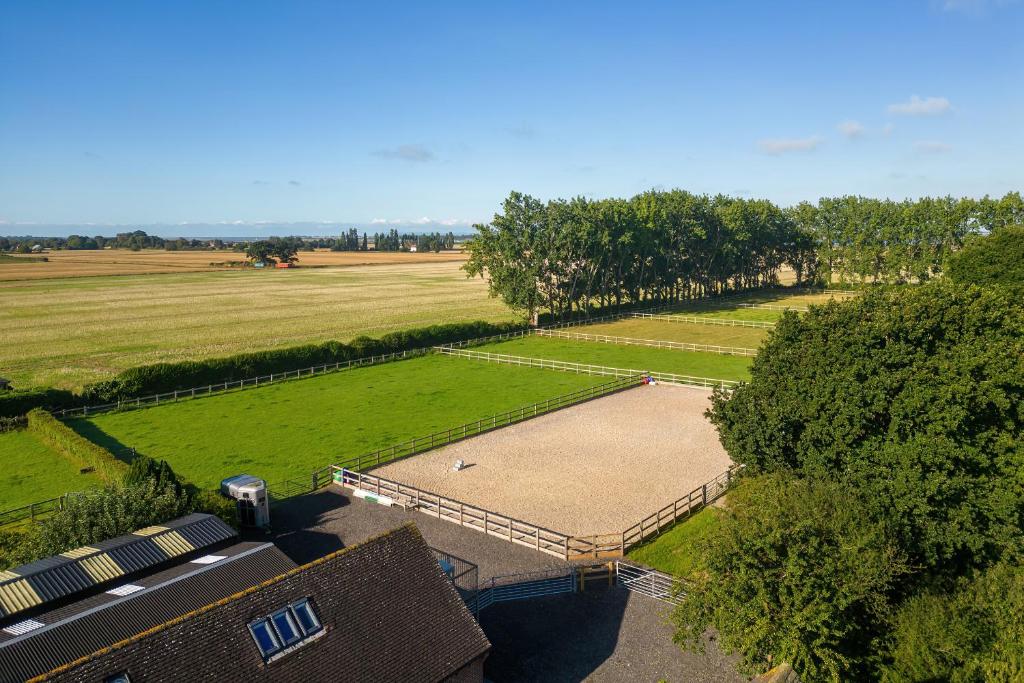 an overhead view of a park with a large field at The Hayloft in Chichester