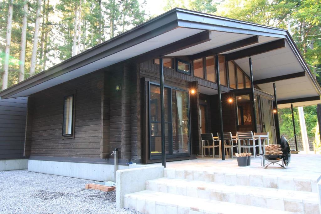 a small house with glass doors and a patio at Yama-gu - House - Vacation STAY 52848v in Inawashiro