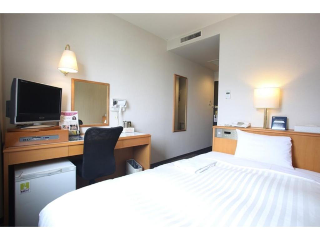 เตียงในห้องที่ Sun Hotel Tosu Saga - Vacation STAY 49468v