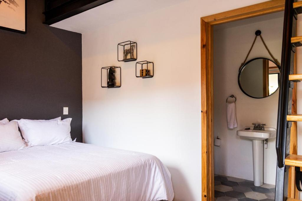 Postel nebo postele na pokoji v ubytování Hostal de la Montaña