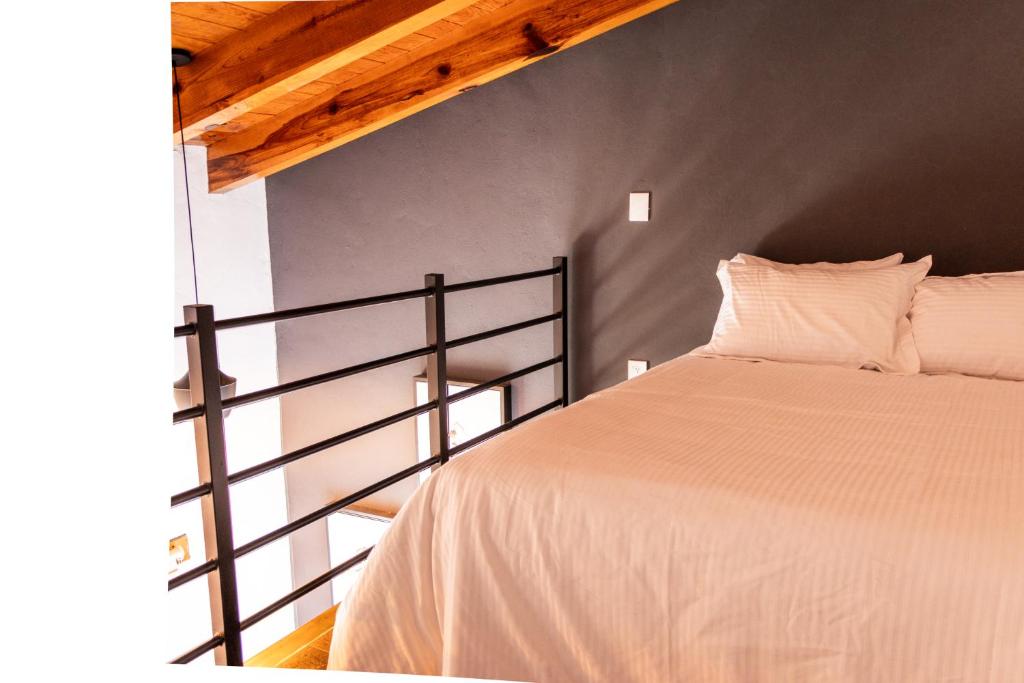 Postel nebo postele na pokoji v ubytování Hostal de la Montaña