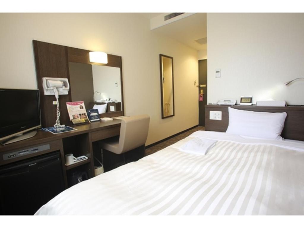 Postel nebo postele na pokoji v ubytování Sun Hotel Tosu Saga - Vacation STAY 49452v