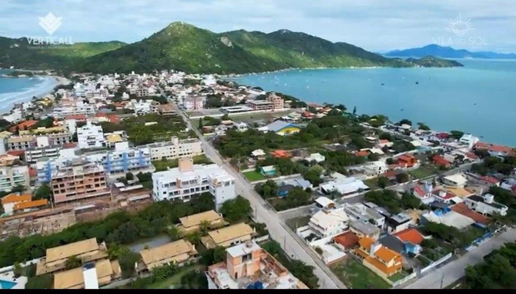 an aerial view of a city next to the water at Res Mariscal em Bombinhas in Canto Grande