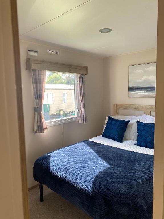 a bedroom with a bed and a window at Cookies Den in Weymouth