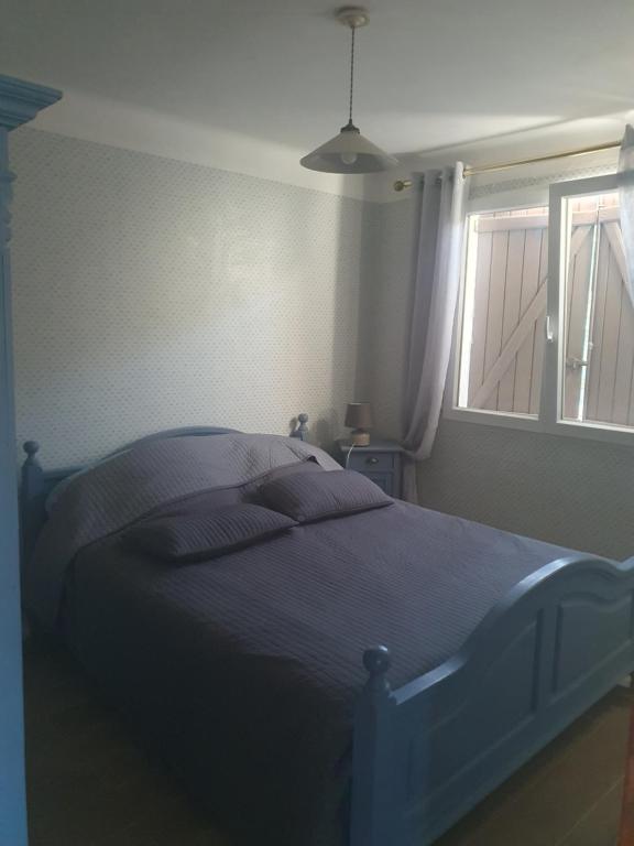 Łóżko lub łóżka w pokoju w obiekcie Villa au coeur des vignes