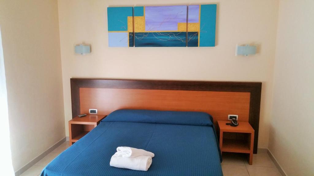 Postel nebo postele na pokoji v ubytování Hotel Club Koiné