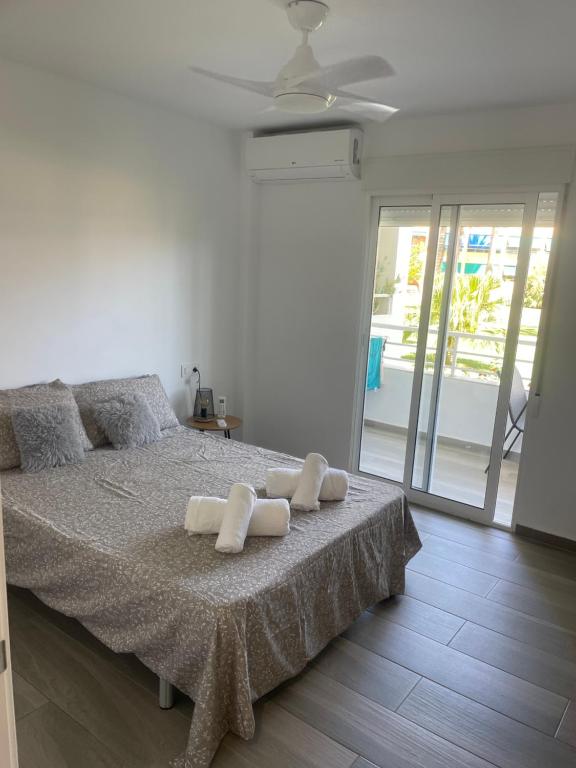 a bedroom with a bed with two pillows on it at Casa Bonita in Jávea