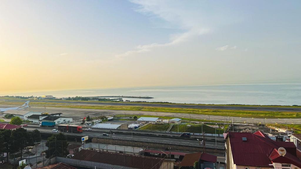 an aerial view of a city with a airport and the ocean at MİLA SUİTE in Trabzon