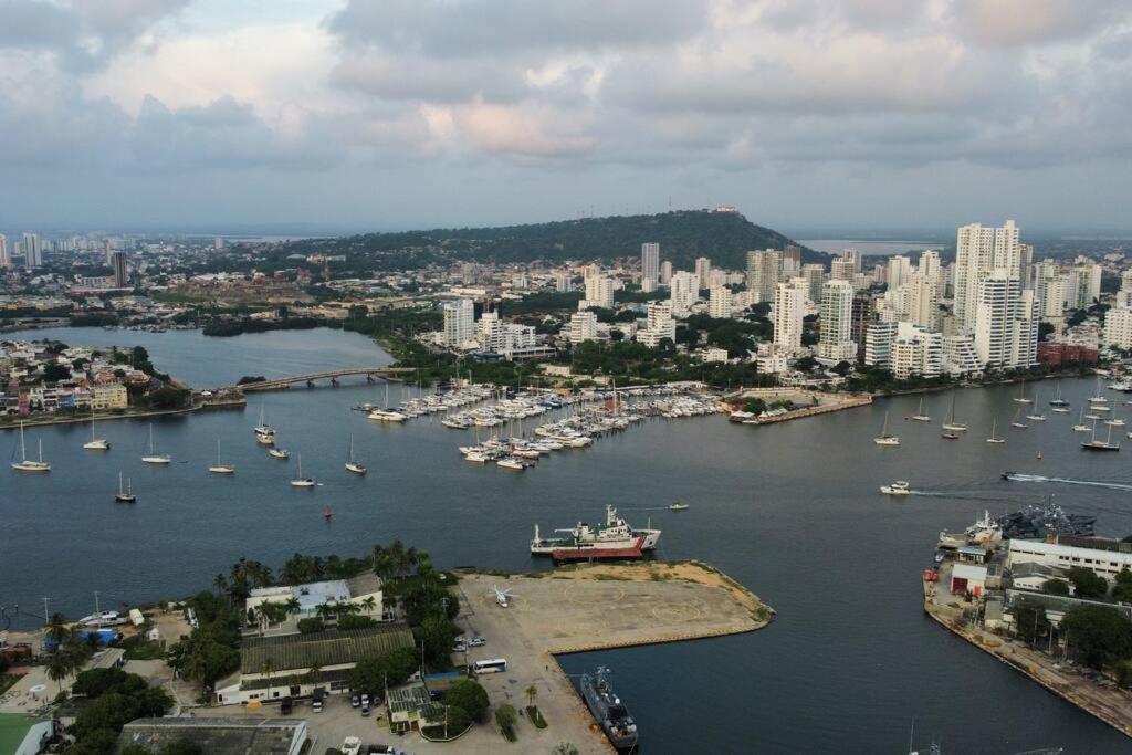 an aerial view of a city with boats in a harbor at Edificio h2 Cartagena 1603 in Cartagena de Indias