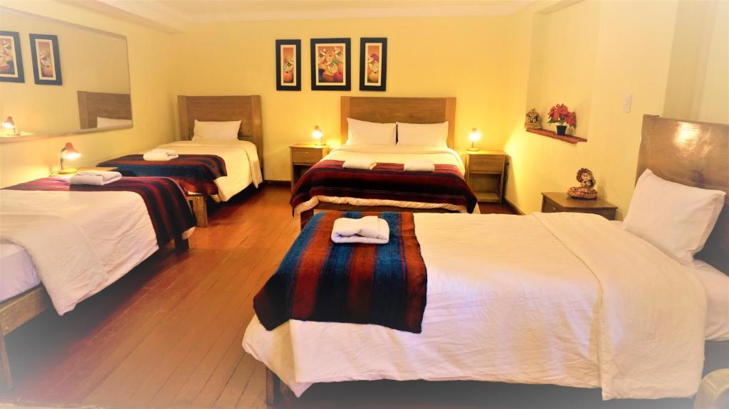 Letto o letti in una camera di Eco Aventura Hostel Cusco