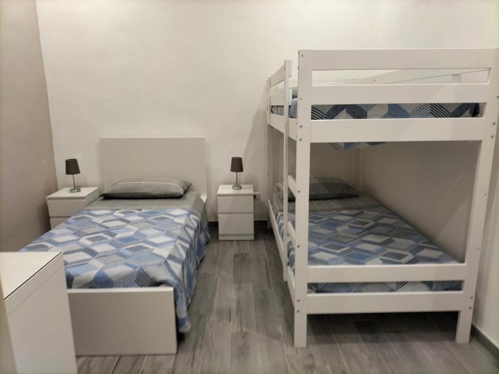 Postel nebo postele na pokoji v ubytování Square House Casa Vacanze