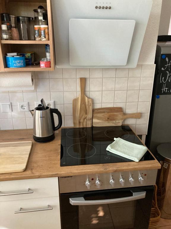 a kitchen with a stove top oven in a kitchen at Premium City Apartment Dresden in Dresden