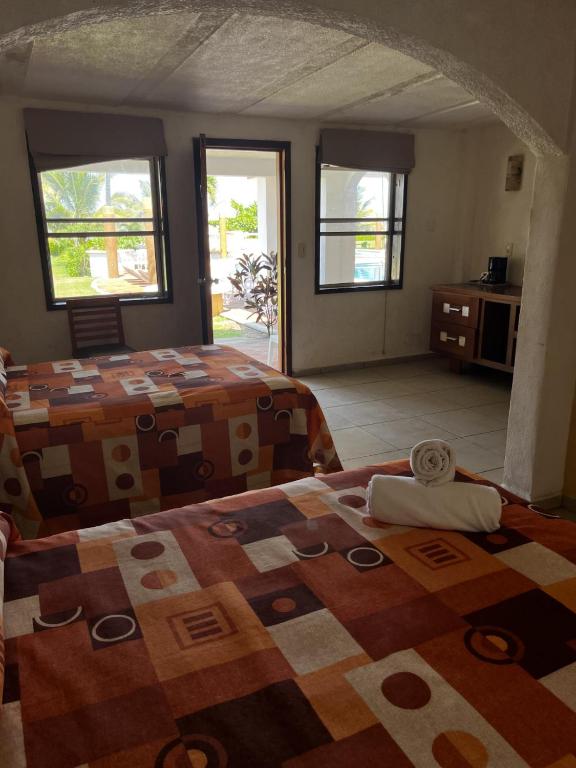 Postel nebo postele na pokoji v ubytování Hotel Torre Molino