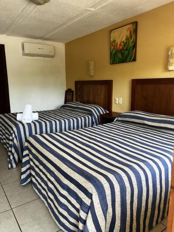 Postel nebo postele na pokoji v ubytování Hotel Torre Molino