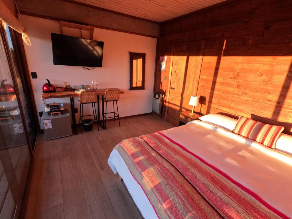Postel nebo postele na pokoji v ubytování Esfera Pichilemu - Lodge