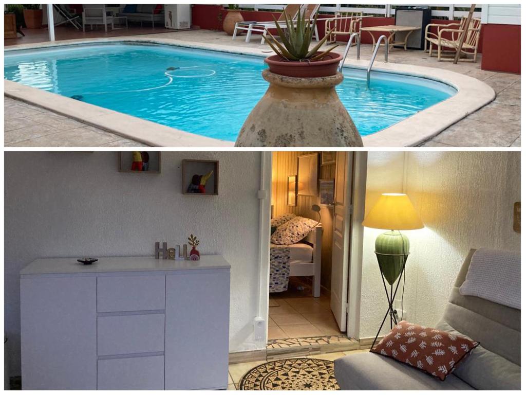 uma casa com piscina e sala de estar em T2 Ti Joe Au cœur de Guadeloupe em Lamentin