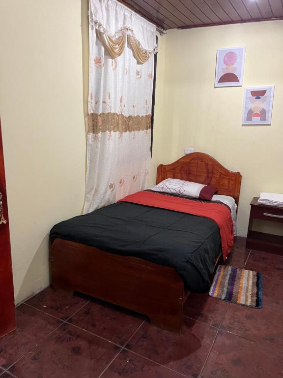 En eller flere senge i et værelse på Residencial Amanda Josefa