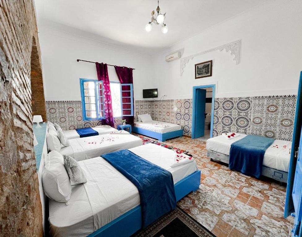 Un pat sau paturi într-o cameră la Guest House Qodwa