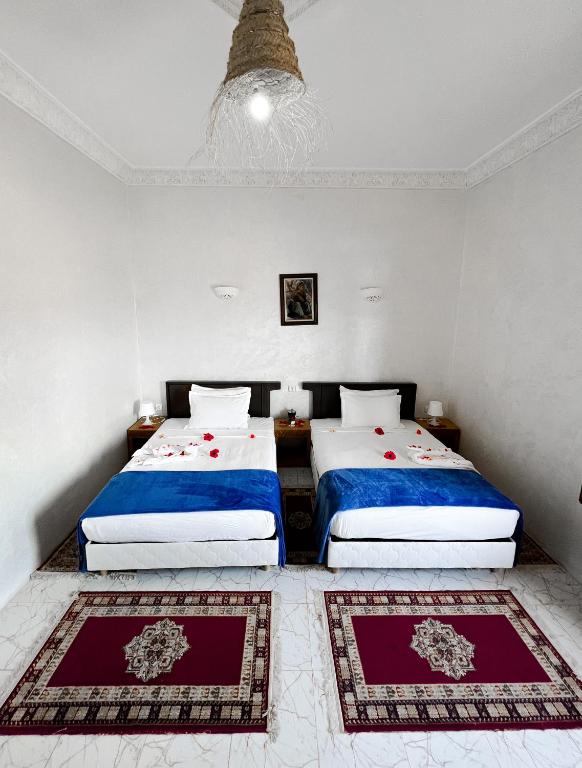Ein Bett oder Betten in einem Zimmer der Unterkunft Guest House Qodwa
