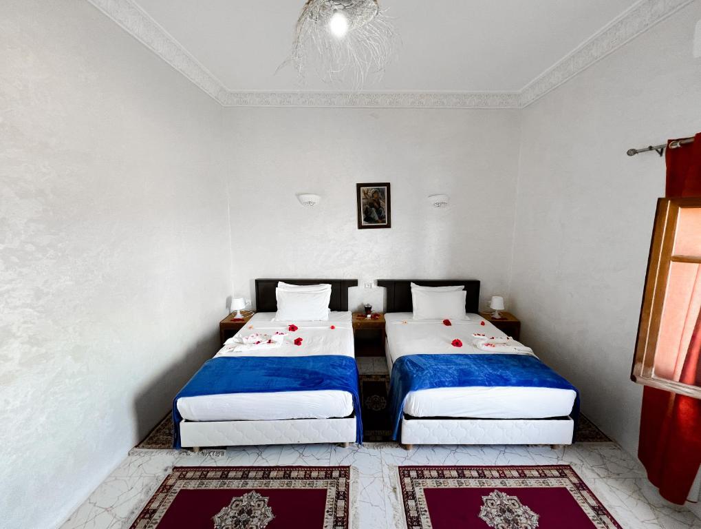 Ein Bett oder Betten in einem Zimmer der Unterkunft Guest House Qodwa
