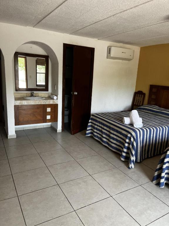 Postel nebo postele na pokoji v ubytování Hotel Torre Molino