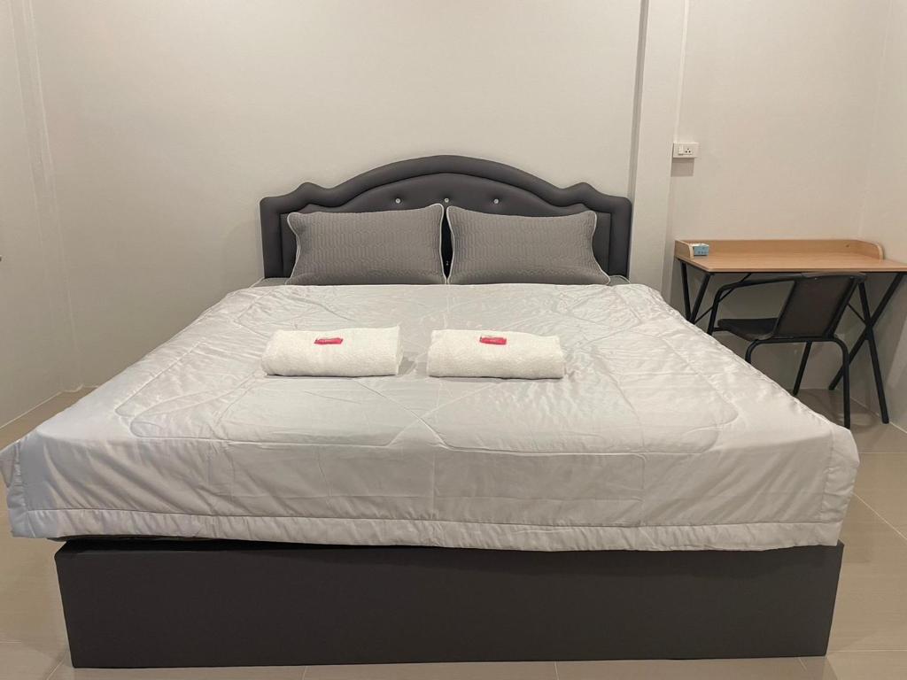 Postel nebo postele na pokoji v ubytování Phu Thai Resort