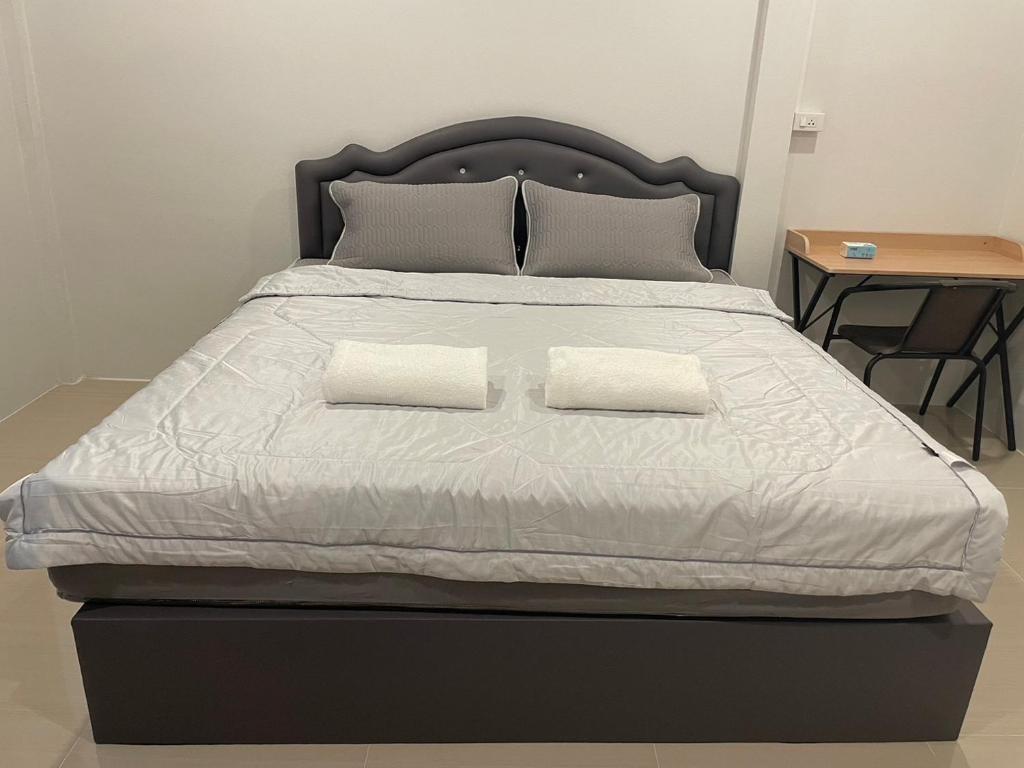 Postel nebo postele na pokoji v ubytování Phu Thai Resort