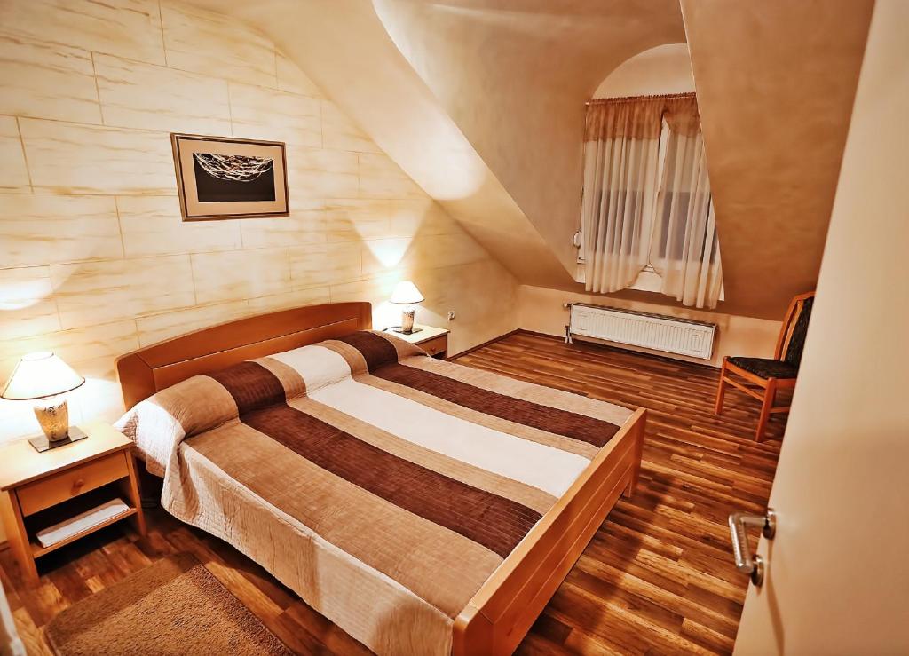 Postel nebo postele na pokoji v ubytování Apartmani Amaro
