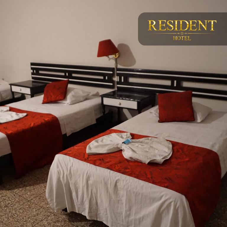 Postel nebo postele na pokoji v ubytování Hotel Resident Piura