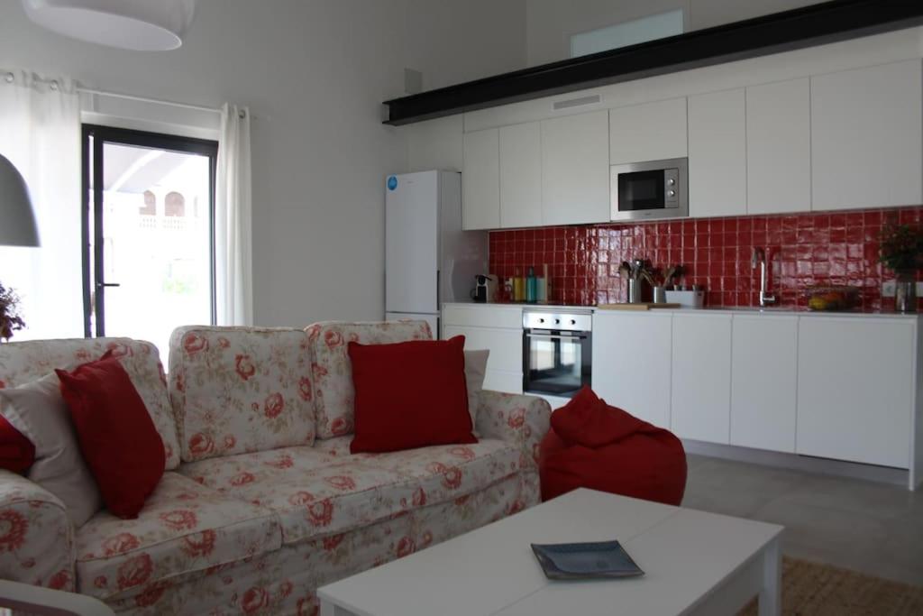 a living room with a couch and a table at El paller de L´Armentera 3 in Saldet