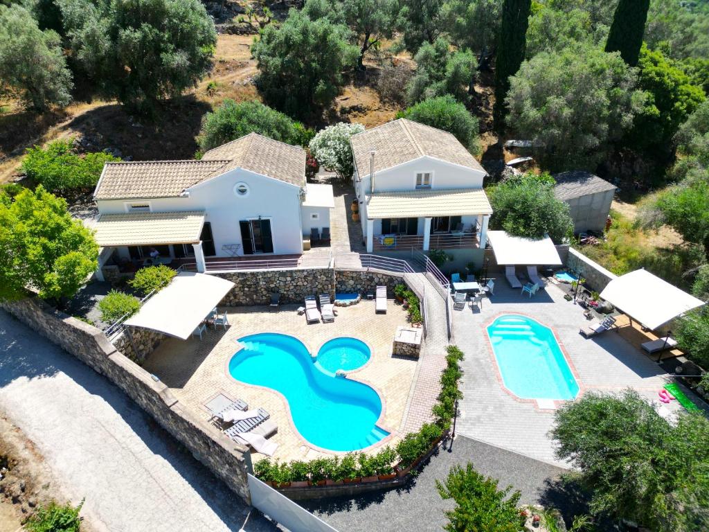 an aerial view of a house with a swimming pool at Casa Nuova in Liapades