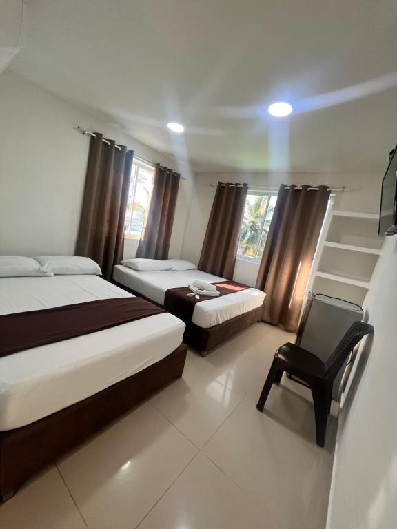 Postel nebo postele na pokoji v ubytování Hotel Playarena