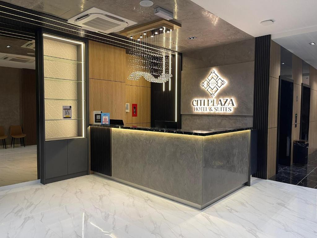 a lobby with a reception desk in a building at DJ Citi Plaza Hotel & Suites in Kuala Terengganu