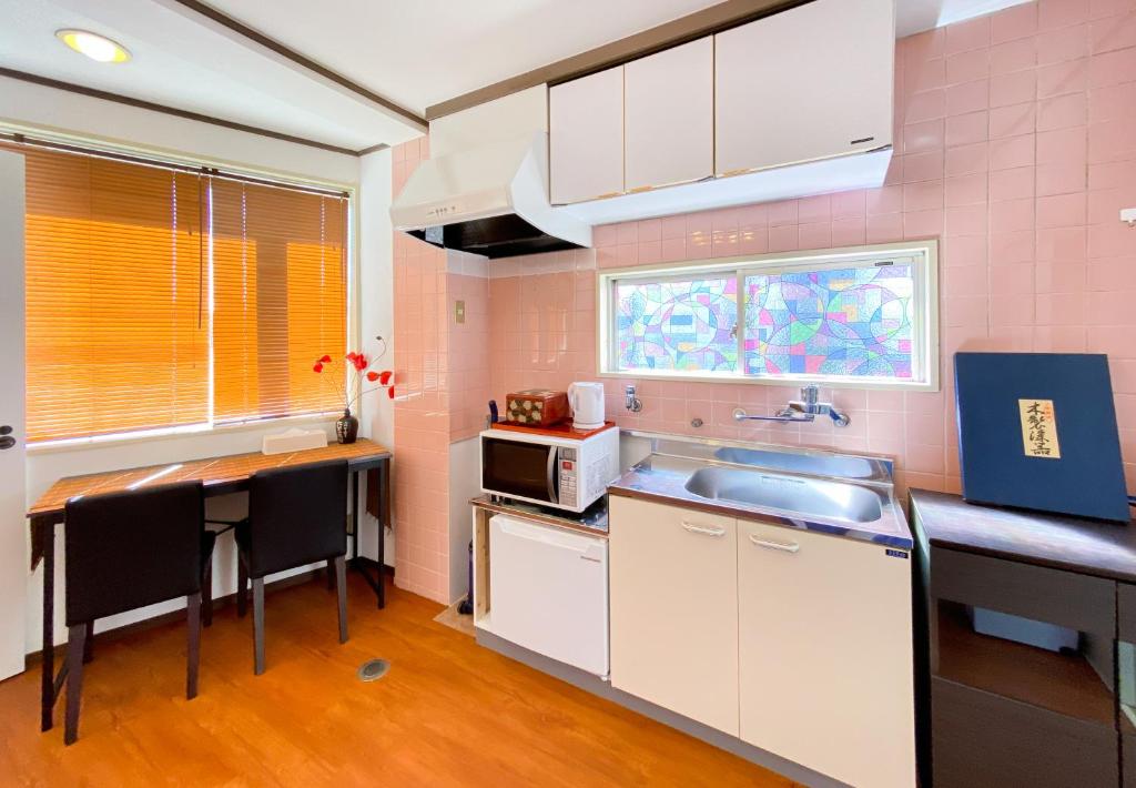 Kuchyň nebo kuchyňský kout v ubytování Uhome Mitomi Home 3F