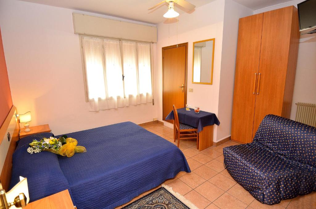 Postel nebo postele na pokoji v ubytování Hotel Amba Alagi