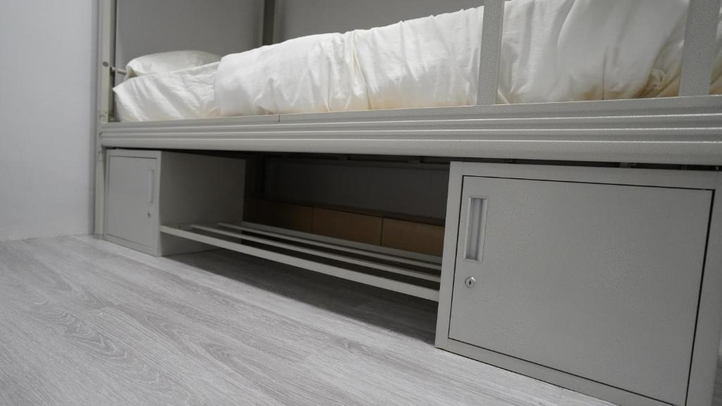 Postel nebo postele na pokoji v ubytování Bubble House Semporna 泡泡屋
