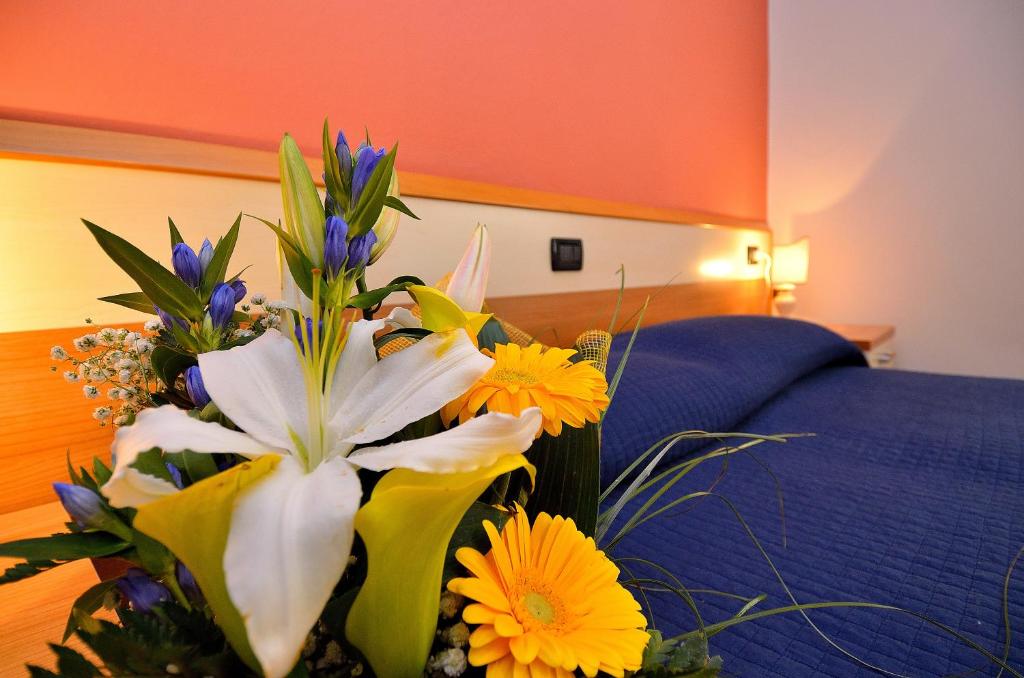 Postel nebo postele na pokoji v ubytování Hotel Amba Alagi
