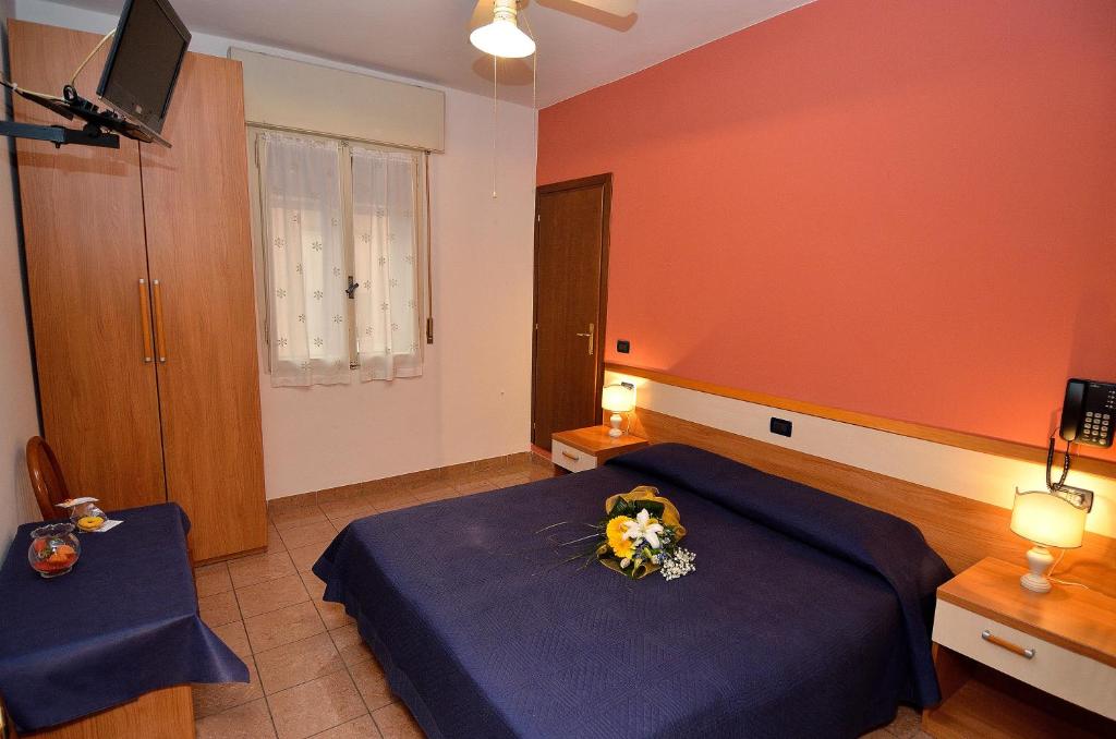Postel nebo postele na pokoji v ubytování Hotel Amba Alagi