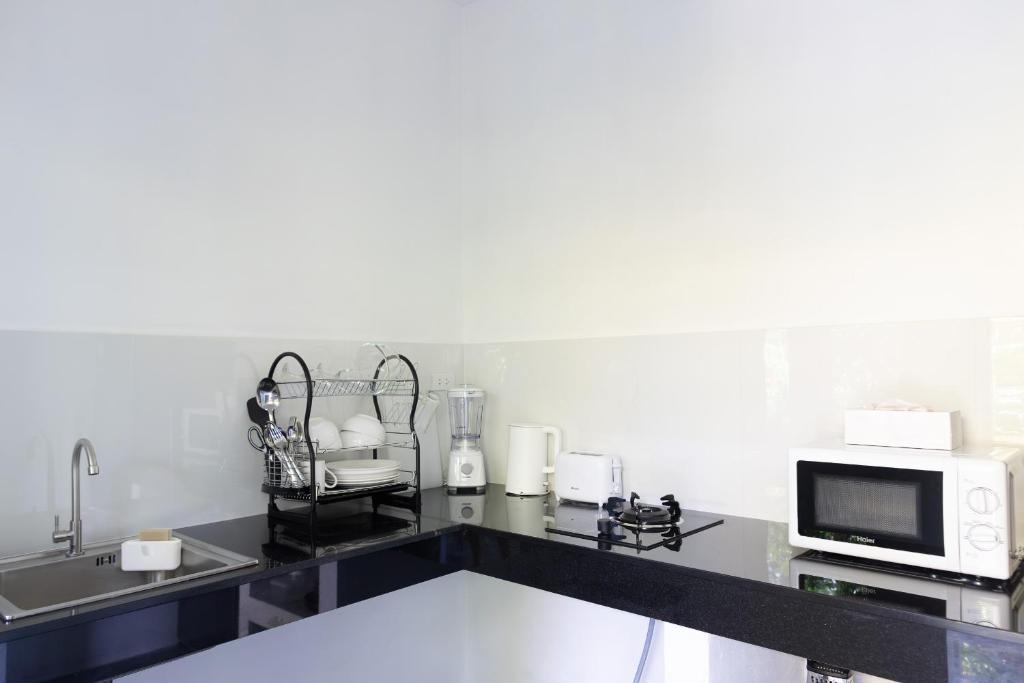 Kuchyň nebo kuchyňský kout v ubytování Apple Villas